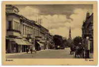 Hlavná ulica s obchodmi a konským povozom, Lučenec (1943)