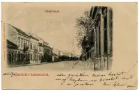Masarykova ulica s vežou kostola v pozadí, Lučenec (1902)